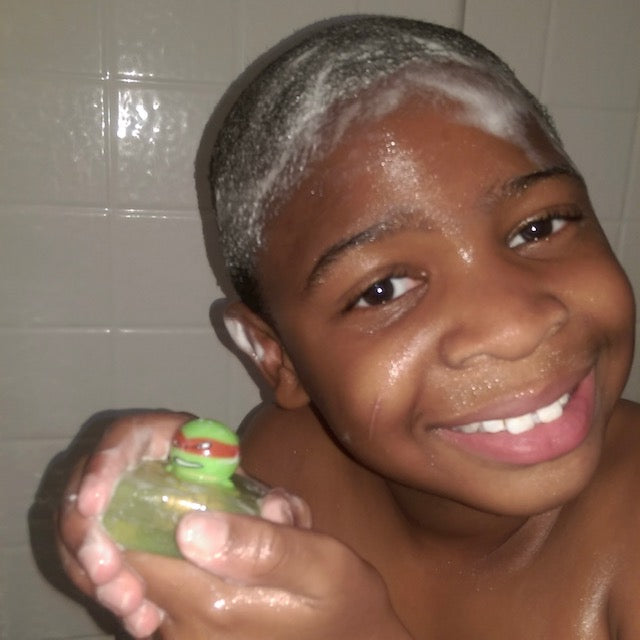 boy holding soap